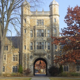The essence of exceptional living a large brick building with trees in front of it
