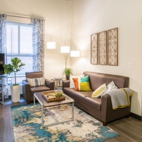 Beautiful living spaces with natural lighting a living room with a couch and a tv