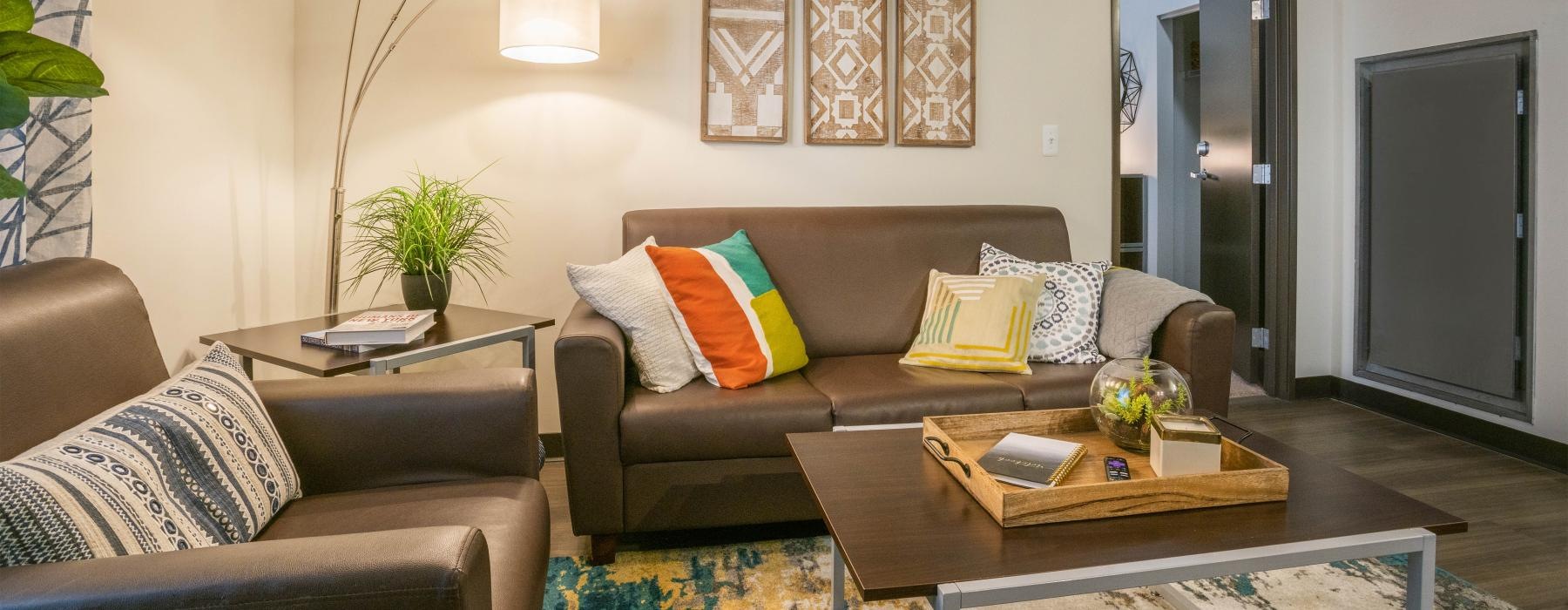 a living room with a couch and coffee table