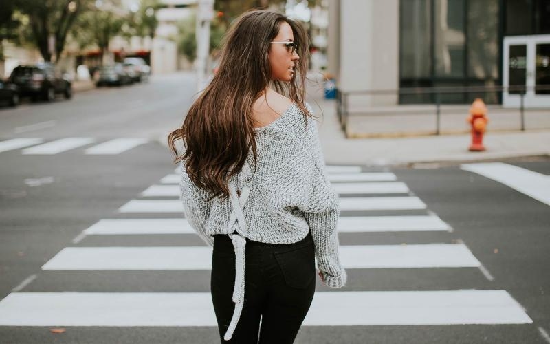 a person walking in a crosswalk