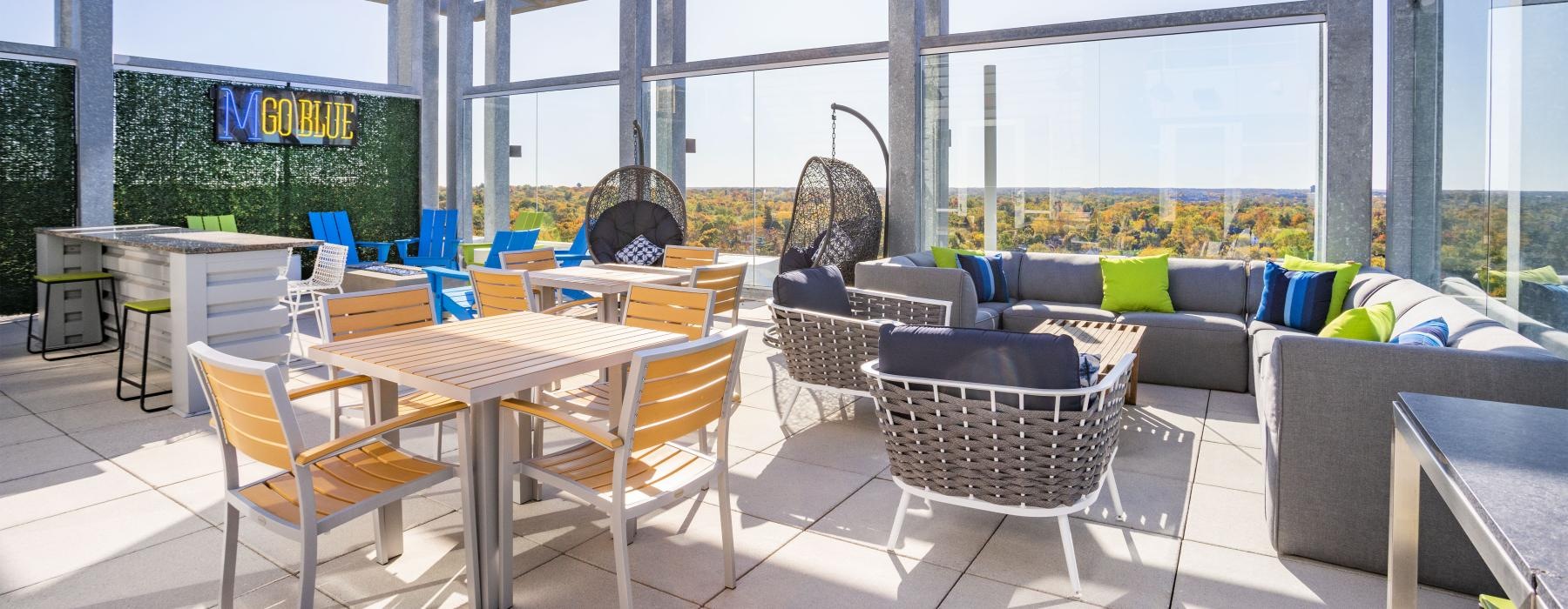 a patio with tables and chairs